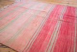 Textural vintage Moroccan Kilim in pale rose, cinnabar red, and grey striped pattern.