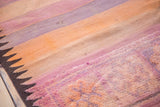 Detail of vintage Kilim carpet, striated bands, triangle pattern, mauve, orange, and ivory.