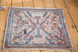 Vintage Persian Bidjar rug, intricate medallion, lattice, and floral-animal motifs, faded copper and blue.