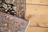 Tightly hand-knotted reverse of a vintage Sarouk rug, showing precise weave and fringed edge.