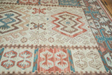 Hand woven kilim rug with faded aqua blue, cochineal red tree and geometric motifs.
