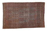 Distressed Belouch carpet featuring faded copper orange and charcoal gray allover geometric cartouche design.