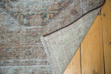 Hand-knotted foundation, short fringe, and textured distressed pile of a Persian Malayer runner.