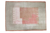 Distressed Ghiordes carpet, sea foam green geometric border, raspberry red blush field.