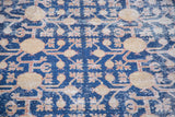 Geometric pomegranate and blossoming floral patterns in saffron gold on distressed navy Khotan.