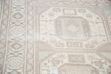 Distressed geometric patterns and soft pastel tones of the vintage Kaisary carpet.