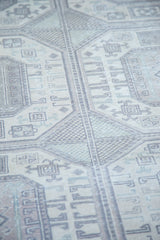 Distressed Turkish Kaisary carpet, highlighting faded geometric guls in soft pastel tones.
