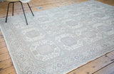 Distressed Turkish Kaisary carpet, triple column geometric guls in pastel blush and sea foam.