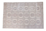 Distressed Turkish Kaisary carpet with geometric guls in pastel blush, seafoam green, and ivory.