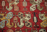 Vintage Oushak runner with tribal rectilinear pinwheel boteh in yellow, blue, beige on madder red.