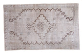 Distressed hand knotted Turkish Oushak rug with diamond medallion, beige and brown contrast.