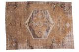 Distressed vintage hand-knotted Oushak carpet with geometric medallion in earthy brown and ivory.