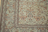 Faded grey/green distressed vintage Turkish Kaisary rug field with muted allover floral design.