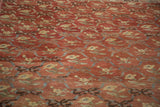 Vintage Oushak runner's sun-softened red field, floral and ribbon lattice design.