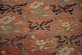 Vintage Oushak runner with blue-grey ribbon lattice and floral motifs on softened red field.