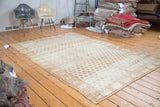 Vintage Oushak carpet border detail highlighting gold abrash and subtle repeating floral patterns.