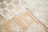 Distressed ivory and gold Oushak rug pile, with shadow floral pattern and woven back.