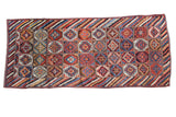 Vintage Kurdish Runner, repeating geometric gul panels in madder red, indigo, ivory, and gold, 4'5