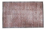 Burnt raspberry distressed Turkish Kaisary rug with allover floral motif and navy border.