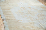 Close-up of the distressed Oushak pile, showing light brown, gold, and platinum shades.