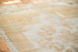 Distressed Oushak carpet texture with visible re-piling in light brown and platinum shades.