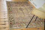 Distressed Oushak runner with bold geometric medallion, arrow motifs, and colorful border.