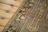 Distressed Oushak runner border detail showcasing geometric patterns and soft mauve pile.