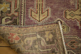 Distressed Oushak runner showing soft mauve pile, geometric patterns, and sturdy hand-knotted backing.