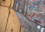 Distressed Lilihan runner pile texture and hand-knotted foundation with stylized motifs.