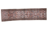 Distressed Lilihan runner: stylized flowers, medallions, blush rose, black cherry red, blue, teal.
