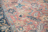 Distressed Persian Heriz carpet, brick red field with worn sickle leaves, adjacent navy samovar border.