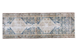 Distressed Malayer runner with ivory and beige double medallions on a navy field.