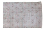 Distressed Oushak hand-knotted carpet, abstract floral lattice on a muted lime green field.