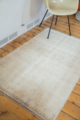 Distressed vintage Tulu rug surface, showing subtle interlatched channels and abrash.