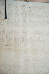 Subtle interlatched channels and distressed texture on a vintage Turkish Tulu rug.