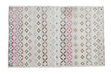 Distressed Oushak rug, modern abstract pattern with circular diamonds in cranberry, saffron, and blue.