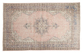 Faded blush rose Distressed Oushak carpet, ornate star medallion, soft neutral borders, 6'1