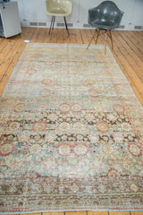 Distressed Sivas carpet detail with faded floral motifs, abrashes, and muted colors.