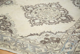 Distressed Oushak runner displaying faded charcoal medallion and soft ivory field with blue accents.