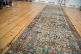 Distressed Malayer runner's worn pile, revealing herati pattern and emerald ground.