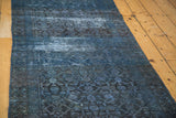 Distressed vintage Herati runner in varying indigo and slate blue tones.