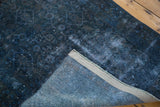Folded corner of the Overdyed Runner, revealing distressed blue Herati pile and woven back.