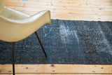 Distressed vintage overdyed runner showing faded Herati motif in indigo and charcoal.
