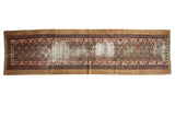Antique Caucasian runner with distressed medallion pattern, Lehla-Abassi border, and camel hair gold.