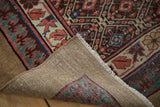 Detail of antique Caucasian rug's hand-knotted foundation and Lehla-Abassi border.