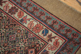 Antique Caucasian runner's classic Lehla-Abassi border and colorful geometric field patterns.