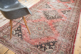 Distressed Turkish Oushak runner with faded cinnabar, charcoal, and beige tribal patterns.