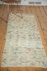 Distressed hand knotted Oushak runner with a playful diamond pattern and fringe detail.