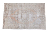 Distressed Oushak rug with faded peach apricot field, scalloped medallion, and light abrashes, 5x8.
