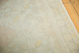 Distressed Oushak runner's soft textured pile with muted ivory and subtle geometric patterns.